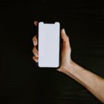 holding iphone