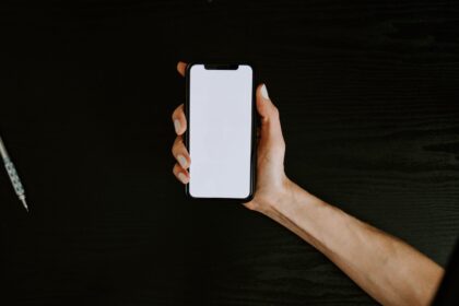 holding iphone