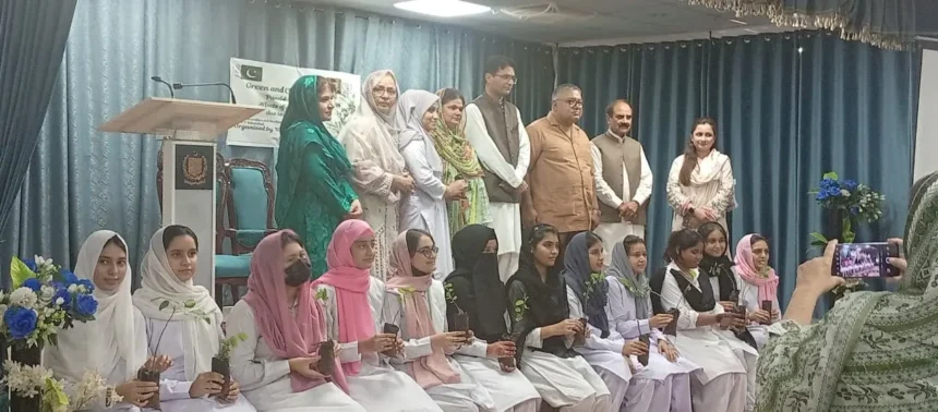Guests planting saplings during a Rising Pakistan Forum plantation drive at Women Welfare and Development Centre in Islamabad