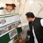 Commissioner Rawalpindi Salman Ghani reviewing construction work at the RDA multi-storey commercial building project on Mayo Road