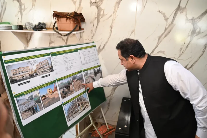 Commissioner Rawalpindi Salman Ghani reviewing construction work at the RDA multi-storey commercial building project on Mayo Road
