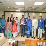 DHO Islamabad annual journal book presented to Federal Health Minister Syed Mustafa Kamal
