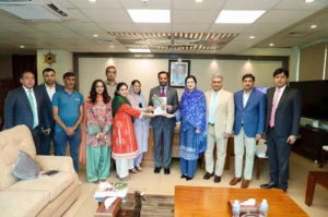 DHO Islamabad annual journal book presented to Federal Health Minister Syed Mustafa Kamal