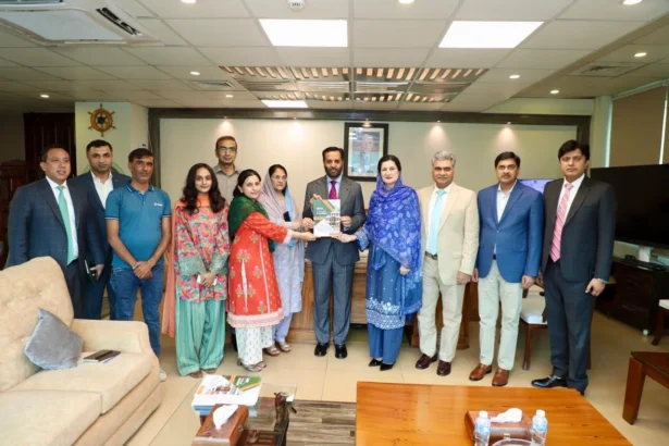 DHO Islamabad annual journal book presented to Federal Health Minister Syed Mustafa Kamal