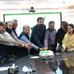 IBCC Executive Director Dr Ghulam Ali Mallah cutting Independence Day cake at IBCC Secretariat Islamabad