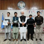 Prof Shahid Mahmood Abbasi presenting awards to SSC high achievers at IMCB I-8/3 Islamabad
