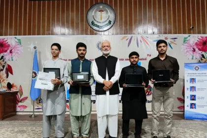 Prof Shahid Mahmood Abbasi presenting awards to SSC high achievers at IMCB I-8/3 Islamabad