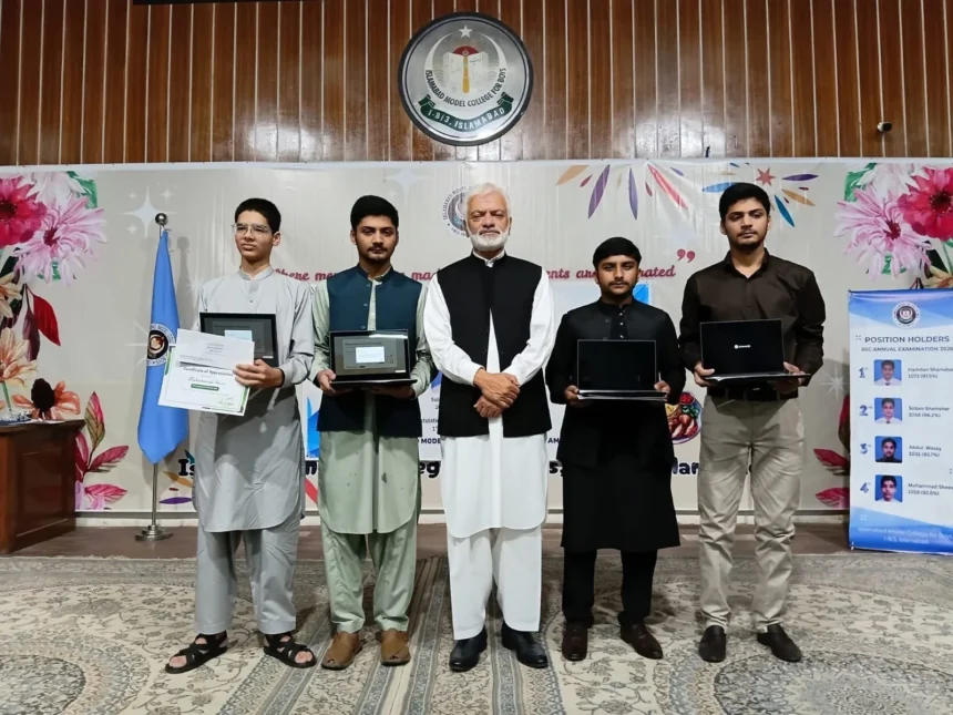 Prof Shahid Mahmood Abbasi presenting awards to SSC high achievers at IMCB I-8/3 Islamabad