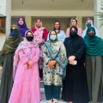 MPhil scholars and faculty members at Women University Mardan after thesis viva voce examinations