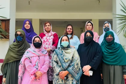 MPhil scholars and faculty members at Women University Mardan after thesis viva voce examinations