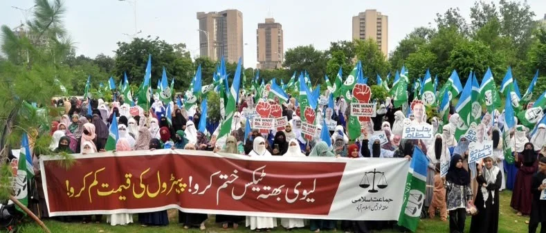 Women holding placards during Jamaat-i-Islami protest outside National Press Club Islamabad
