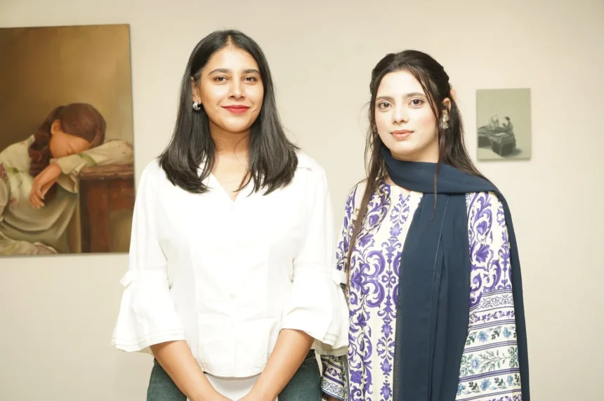 Visitors view artworks at the PNCA Young Graduates Exhibition in Islamabad