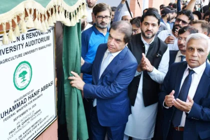 Federal Minister Muhammad Hanif Abbasi inaugurating the renovated auditorium at PMAS Arid Agriculture University Rawalpindi