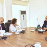 Dr Musadik Malik meeting UN-Habitat officer Oddy Angelo in Islamabad