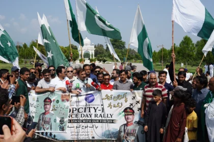Vehicles decorated with national flags during Top City-1 Defence Day motor rally in Islamabad