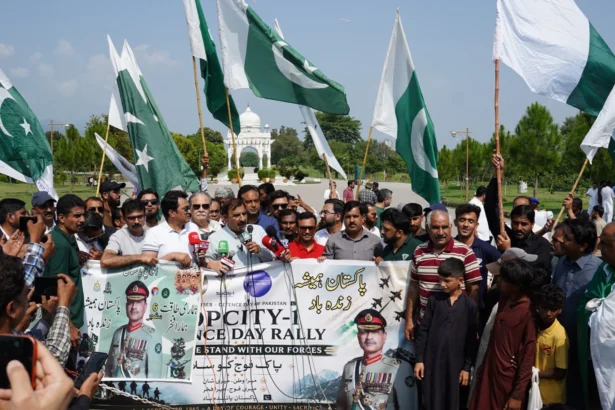 Vehicles decorated with national flags during Top City-1 Defence Day motor rally in Islamabad