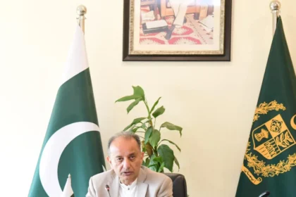 Federal Minister for Climate Change Dr Musadik Malik addressing a seminar on migration governance