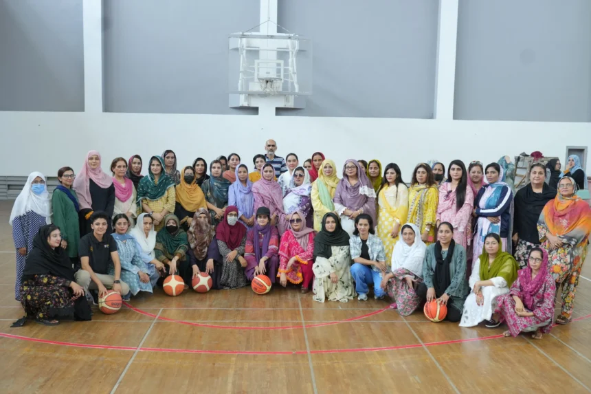 Female sports teachers attending basketball training at Pakistan Sports Complex Islamabad