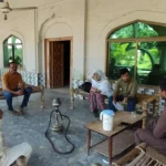 PDA Citizen Experience team conducting field research with farmers in Bhera