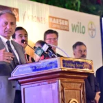 Federal Minister Dr Musadik Malik addressing a German Unity Day ceremony in Islamabad